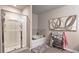 Elegant bathroom with a separate shower, soaking tub, and tile accents at 3401 Endurance Ct # 10, Atlanta, GA 30349
