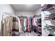 Walk-in closet with built-in shelving and ample storage space for clothes and shoes at 3401 Endurance Ct # 10, Atlanta, GA 30349