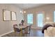 Cozy dining area featuring a glass table, velvet chairs, and natural light at 3401 Endurance Ct # 10, Atlanta, GA 30349