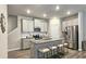 Modern kitchen with stainless steel appliances, granite countertops, and an island with seating at 3401 Endurance Ct # 10, Atlanta, GA 30349
