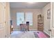Functional home office space with desk, shelving, and ample natural light at 3401 Endurance Ct # 10, Atlanta, GA 30349