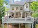 Spacious backyard deck with outdoor seating and a grill, perfect for entertaining at 3722 Somerset Nw Rdg, Kennesaw, GA 30144