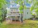 Lovely home exterior with a spacious deck, spiral staircase, and landscaped yard at 3722 Somerset Nw Rdg, Kennesaw, GA 30144