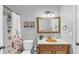 Well-maintained bathroom with tub and shower, vanity with stylish mirror, and decorative accents at 3722 Somerset Nw Rdg, Kennesaw, GA 30144
