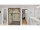 Bathroom with tiled shower, separate toilet, vanity and mirror at 3722 Somerset Nw Rdg, Kennesaw, GA 30144