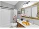Well-maintained bathroom with tub and shower, vanity with stylish mirror, and decorative accents at 3722 Somerset Nw Rdg, Kennesaw, GA 30144