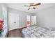 Well-lit bedroom shows closet and bathroom doors and features hardwood floors and ceiling fan at 3722 Somerset Nw Rdg, Kennesaw, GA 30144