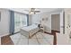 Bright bedroom featuring a ceiling fan, cozy rug, and ample natural light at 3722 Somerset Nw Rdg, Kennesaw, GA 30144