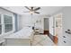 Well-lit bedroom featuring a ceiling fan, cozy rug, and ample natural light at 3722 Somerset Nw Rdg, Kennesaw, GA 30144