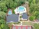 Aerial view of community pool and tennis courts with landscaped grounds and clubhouse amenities at 3722 Somerset Nw Rdg, Kennesaw, GA 30144