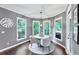Bright dining area features hardwood floors, pendant lighting, and large windows offering outdoor views at 3722 Somerset Nw Rdg, Kennesaw, GA 30144