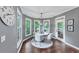 Cozy dining area with hardwood floors, natural light, and access to the outdoor deck, perfect for gatherings at 3722 Somerset Nw Rdg, Kennesaw, GA 30144