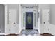 Bright and airy foyer with a decorative front door and elegant finishes at 3722 Somerset Nw Rdg, Kennesaw, GA 30144