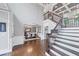Spacious foyer featuring a staircase, dining area, and elegant hardwood floors at 3722 Somerset Nw Rdg, Kennesaw, GA 30144