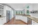 Bright kitchen features stainless steel appliances, white cabinets, and granite countertops at 3722 Somerset Nw Rdg, Kennesaw, GA 30144