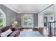 Bright living room with hardwood floors, large windows, and stylish decor at 3722 Somerset Nw Rdg, Kennesaw, GA 30144