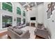 Bright living room with high ceilings, large windows, a fireplace, and comfortable seating at 3722 Somerset Nw Rdg, Kennesaw, GA 30144