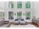 Bright living room with vaulted ceilings, large arched windows, and view to the outdoor space at 3722 Somerset Nw Rdg, Kennesaw, GA 30144