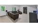 A well-lit living room with a large sectional sofa and an open closet or storage area at 3722 Somerset Nw Rdg, Kennesaw, GA 30144