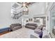 Open-concept living area with staircase, high ceilings, and access to the kitchen at 3722 Somerset Nw Rdg, Kennesaw, GA 30144