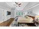 Spacious main bedroom with wood floors, tray ceiling, and abundant natural light at 3722 Somerset Nw Rdg, Kennesaw, GA 30144
