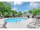 Community outdoor swimming pool with lounge seating and nearby building at 3722 Somerset Nw Rdg, Kennesaw, GA 30144