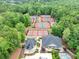 Aerial view of community tennis courts amidst lush greenery near club house at 3722 Somerset Nw Rdg, Kennesaw, GA 30144