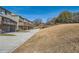 Spacious backyard view of townhomes featuring driveways, garages and back decks at 3901 High Dove Sw Way # 17, Smyrna, GA 30082