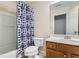 Bright bathroom features a shower and vanity with wood cabinets at 3901 High Dove Sw Way # 17, Smyrna, GA 30082