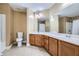 Bathroom features dual sinks, wood cabinets and tile floors at 3901 High Dove Sw Way # 17, Smyrna, GA 30082