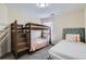 Cozy bedroom with a wood bunk bed, twin bed and soft carpet at 3901 High Dove Sw Way # 17, Smyrna, GA 30082