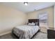 Comfortable bedroom featuring soft carpet and a large window for natural light at 3901 High Dove Sw Way # 17, Smyrna, GA 30082