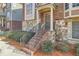 Charming brick townhome entrance with inviting steps and landscaped greenery at 3901 High Dove Sw Way # 17, Smyrna, GA 30082