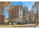 Brick townhome showcasing detailed architectural design and well-maintained front lawn at 3901 High Dove Sw Way # 17, Smyrna, GA 30082