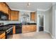 Well-equipped kitchen featuring granite countertops and modern black appliances at 3901 High Dove Sw Way # 17, Smyrna, GA 30082