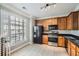 Bright kitchen offering stainless steel appliances, granite countertops, and ample cabinet space at 3901 High Dove Sw Way # 17, Smyrna, GA 30082