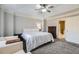 Spacious main bedroom features soft carpet, ceiling fan, and en suite bathroom at 3901 High Dove Sw Way # 17, Smyrna, GA 30082