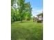 A spacious backyard with a lush lawn perfect for outdoor activities and relaxation at 415 Gray Rd, Carrollton, GA 30116