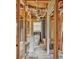Unfinished bathroom with visible framing, tub, sink and toilet at 415 Gray Rd, Carrollton, GA 30116