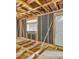 The interior of a home with exposed studs, a door, and a window ready for renovation at 415 Gray Rd, Carrollton, GA 30116