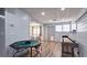 Bright basement area with games, table, and door leading to the exterior at 1657 Millhouse Lndg, Marietta, GA 30066