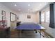 Basement area with ping pong table, bar, and door at 1657 Millhouse Lndg, Marietta, GA 30066