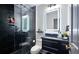 Modern bathroom featuring a sleek glass shower, elegant vanity, and contemporary fixtures at 1657 Millhouse Lndg, Marietta, GA 30066