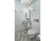 Modern bathroom with stone tile floors and walls, vessel sink, and modern toilet in a minimalist design at 1657 Millhouse Lndg, Marietta, GA 30066