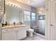 Modern bathroom featuring a glass-enclosed shower, granite counters, and updated fixtures at 1657 Millhouse Lndg, Marietta, GA 30066