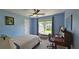 Cozy bedroom with a ceiling fan, a window with a view, and a desk area at 1657 Millhouse Lndg, Marietta, GA 30066