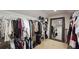 Spacious walk-in closet with ample hanging space and shelving for organized storage at 1657 Millhouse Lndg, Marietta, GA 30066