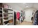 Organized closet with shelving for shoes and handbags, as well as hanging space for clothing at 1657 Millhouse Lndg, Marietta, GA 30066