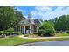 Exterior shot of the community clubhouse with manicured landscaping and architectural details at 1657 Millhouse Lndg, Marietta, GA 30066