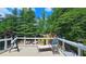 Enjoy the lush surroundings from this cozy deck with comfortable seating at 1657 Millhouse Lndg, Marietta, GA 30066
